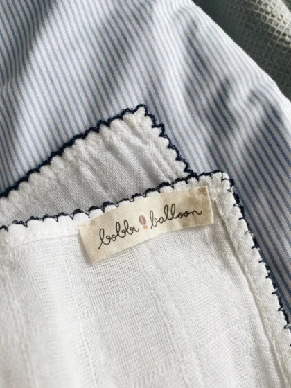 Muselina con ribete  color azul marino